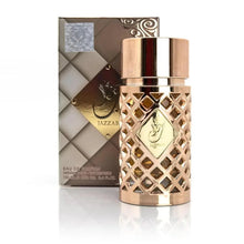Luxury Arabian oud perfume bottle with gold lattice design and matching elegant box