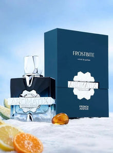 Aromatix Frostbite extrait de parfum bottle and box with citrus slices on snow, luxury fragrance product.