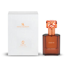 Swiss Arabian Oud 01 perfume bottle with ornate gold cap next to white packaging box