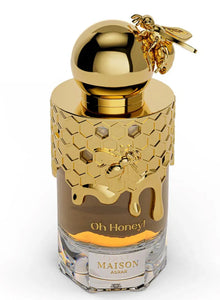 Luxury Arabian oud perfume bottle with gold honeycomb design, bee accents, and embossed 'Oh Honey!' label.