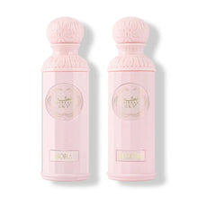 Two elegant pink Arabian oud perfume bottles labeled Sora and Ellora with embossed caps