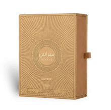 Nebras Elixir Eau de Parfum golden box with sunburst design, 100ml Arabian fragrance.