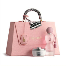 Elegant pink perfume gift set with gold details, includes Laverne perfume, cream, and stylish bag