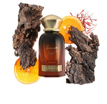 Summer Oud perfume bottle with oud wood, orange slices, and saffron accents