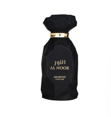 Black geometric Al Noor perfume bottle with gold accents, luxury Arabian fragrance.