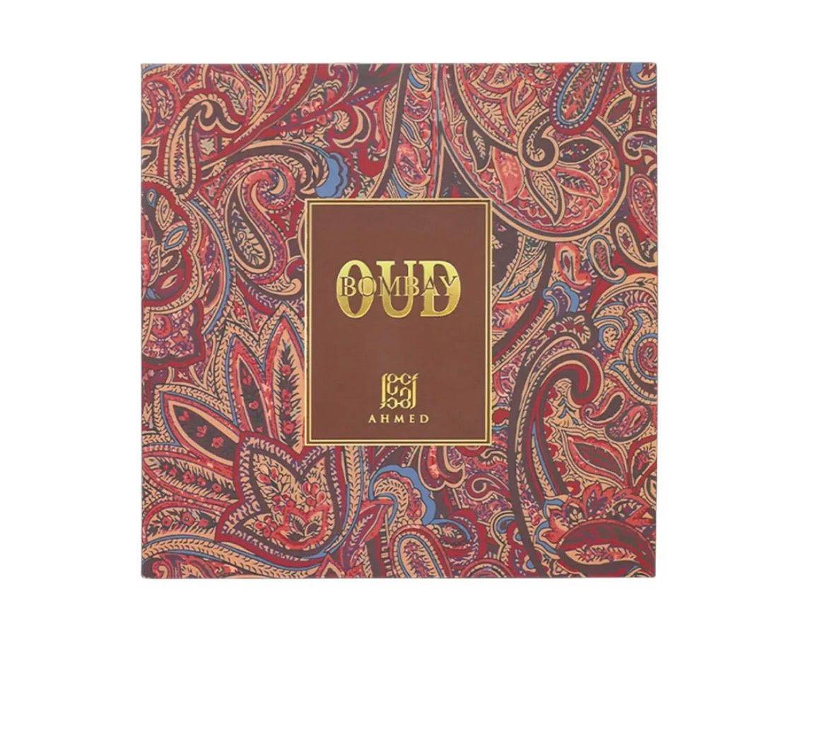 Product packaging with paisley design and 'Oud' branding on a white background