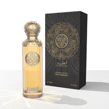 Elegant Arabian oud perfume bottle with ornate gold design next to luxury black box