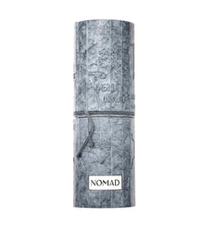 NOMAD grey cylindrical Arabian oud perfume packaging with embossed map design.