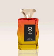 Luxury oud perfume bottle with gradient red and yellow glass, gold cap, and black label