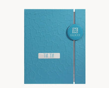 Blue textured perfume gift box labeled Tiff Tiff, elegant Arabian oud packaging.