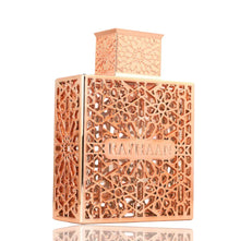 Elegant gold Arabian oud perfume bottle with ornate lattice design and RAYHAAN label.
