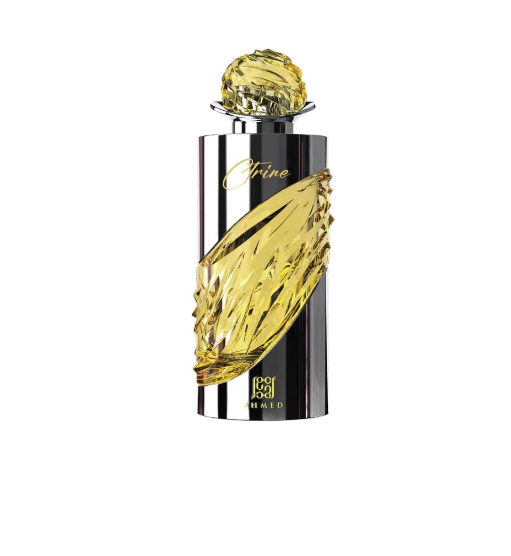 Perfume bottle with yellow cap and decorative elements on a white background