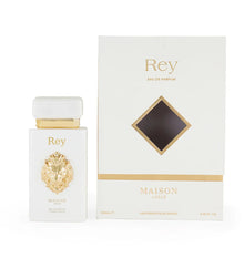 Rey Maison Asrar eau de parfum bottle with gold lion emblem and matching luxury perfume box