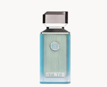 Elegant blue gradient glass bottle of Arabian oud perfume labeled Tiff Tiff with metallic cap