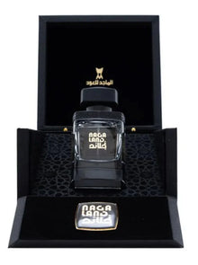 Luxury Arabian oud perfume bottle labeled 'Naga Land' in elegant black gift box