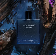 Nocturno Pour Homme Rayhaan men's oud perfume bottle with water drops, wood, and floral accents