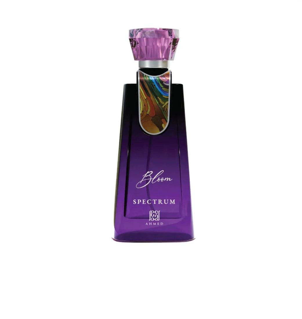 Purple perfume bottle with colorful cap on a white background