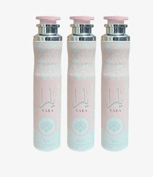 Three Yara air freshener spray cans with pink and silver floral design, 300ml each.