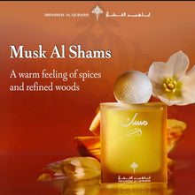 Musk Al Shams Arabian perfume bottle with floral accents on a warm orange background