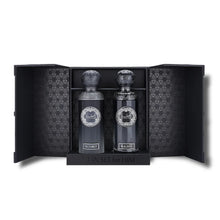 Luxury Arabian oud perfume gift set with two ornate bottles labeled Maximus and Magnus in an open black box.
