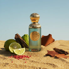 Luxurious Arabian oud perfume bottle with gold details, surrounded by lime, spices, and wood on sand
