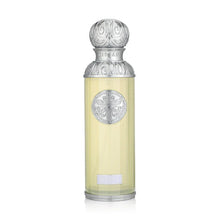 Elegant Arabian oud perfume bottle with silver ornate cap and label, luxury fragrance.