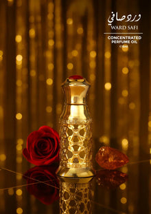 Gold ornate perfume oil bottle with red rose and amber stone on reflective golden background.