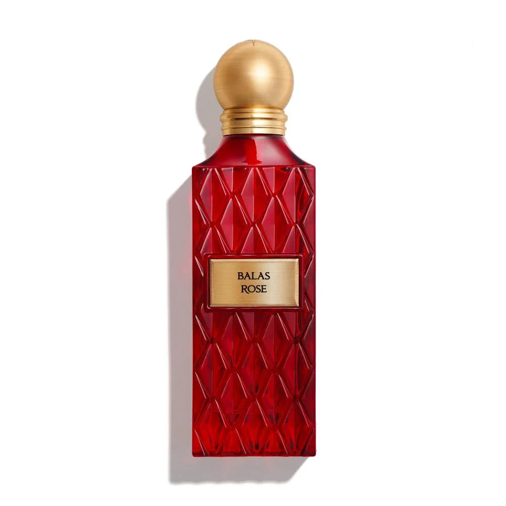 Red perfume bottle with gold cap on a white background