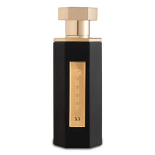 Luxury Arabian oud perfume bottle with black and gold design labeled REEF 33