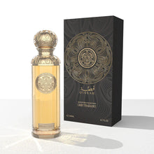 Elegant Gissah oud perfume bottle with ornate gold design beside matching black and gold box