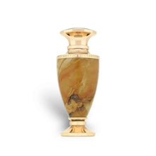 Gold and marble luxury oud perfume bottle on white background