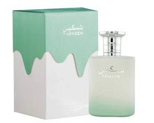 Taskeen luxury perfume bottle with matching mint green and white box, Arabian oud fragrance