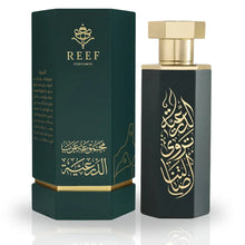 Luxury Arabian oud perfume bottle with gold Arabic calligraphy and green gift box