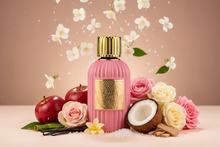 Pink perfume bottle with gold cap surrounded by roses, apple, coconut, vanilla, and white flowers