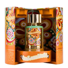 Indomitable perfume bottle with colorful floral packaging, gold cap, and retro design