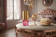 Elegant oud perfume bottle with gold cap on marble table beside caramel dessert and cake in a luxurious bedroom.