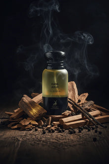 Dark Aoud perfume bottle surrounded by oud wood, spices, and smoke for Arabian fragrance