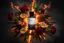 Oud Madness perfume bottle with fiery backdrop, surrounded by red roses, passion fruit, and oud wood.
