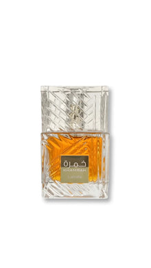 Lattafa Khamrah Arabian oud perfume in clear geometric glass bottle with amber liquid