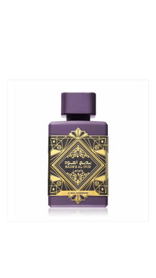 Purple Bade'e Al Oud Amethyst perfume bottle with gold geometric design and Arabic script