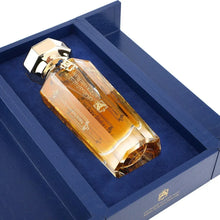 Luxury Arabian oud perfume bottle with gold cap in elegant blue gift box