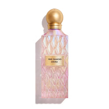 Pink Diamond Sakura perfume bottle with textured pink glass and gold cap on white background
