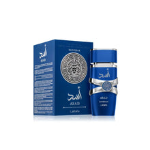 Blue Lattafa Asad Zanzibar perfume bottle and box with silver lion motif on white background