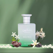 Taskeen Lactea Divina perfume bottle with white flowers and spices on green background