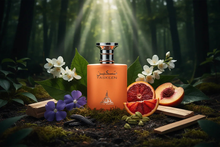 Orange perfume bottle in forest surrounded by blood orange, jasmine, sandalwood, violet, cardamom, and peach