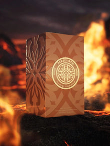 Gold Perseviron Paris Corner perfume box with ornate design, displayed amid fiery background