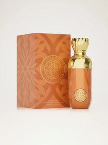 Luxury Arabian oud perfume bottle with gold cap beside matching ornate box, labeled Perseviron.