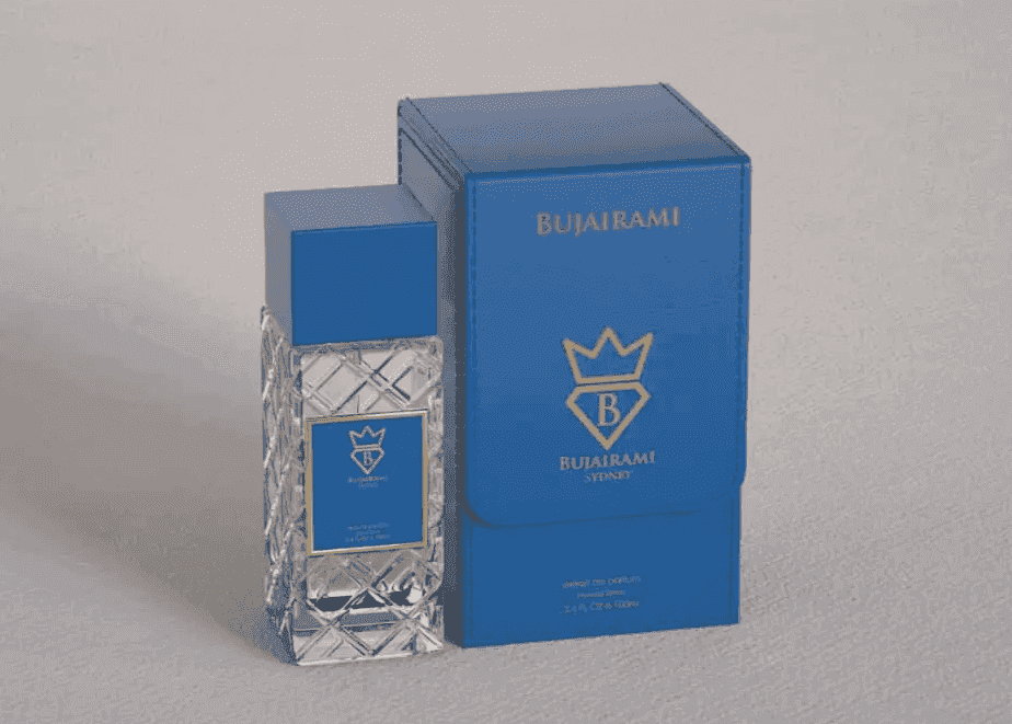 Bujairami perfume bottle and packaging on a gray background