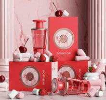 Pink perfume bottles and boxes with strawberries, cherries, and marshmallows on marble background