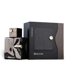Ghost Spectre perfume bottle with metallic finish next to black textured gift box